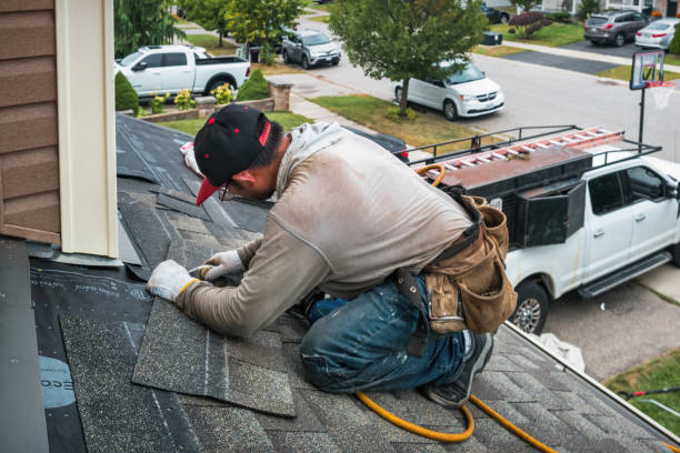 Professional Storm Damage Roof Repair technician working in Columbus, TX